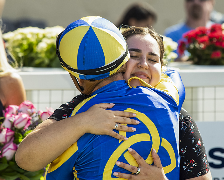 A celebratory embrace after the race